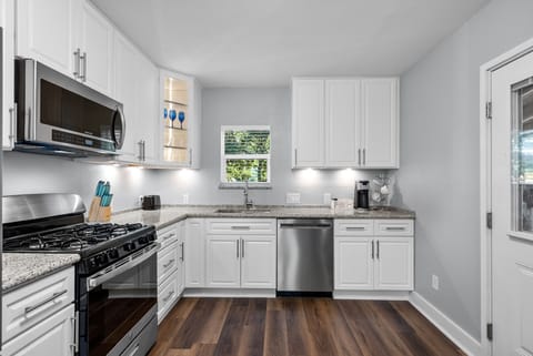 Under cabinet lighting, single-serve coffee maker + coffee.