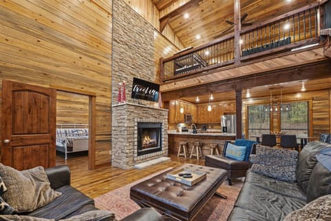 The living area offers a luxurious space for relaxation with elegant décor and a warm fireplace.