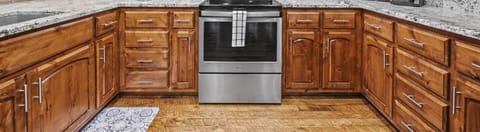 Our kitchen features modern appliances and rustic cabinetry, perfect for family meals.