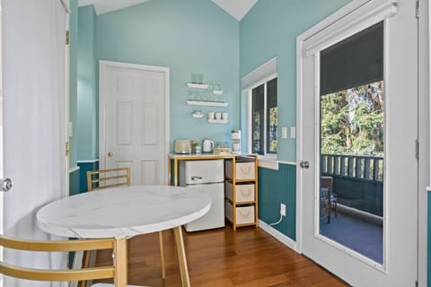 Kitchenette complete with a mini fridge, microwave, toaster, coffee and dishes.