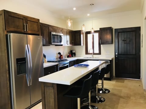 Kitchen with whirlpool appliances. Kitchen island seating for 4