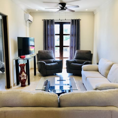 Living room with great natural light & plenty of comfortable seating.