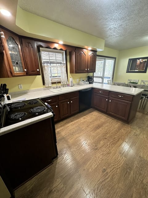 Fully Stocked Kitchen with view of eat-in dining 