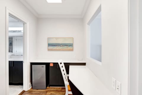 Bedroom 7 has a desk and mini fridge