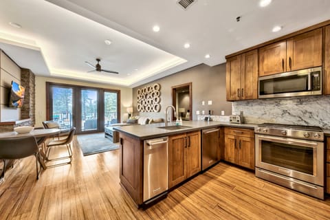 Kitchen has plenty of space and modern appliances for the chef