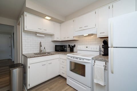 Granite counters and subway tile make this kitchen feel a little more like home.