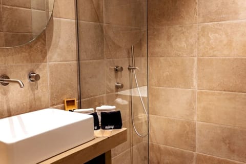 Shower, eco-friendly toiletries, hair dryer, towels