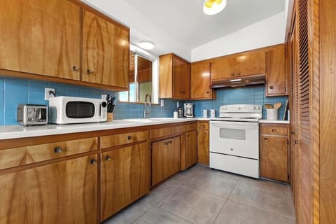 The kitchen is stocked with all of the comforts of home such as dishes, utensils, pots, pans, coffee maker, toaster, microwave, and basic cooking essentials like olive oil, salt and pepper.