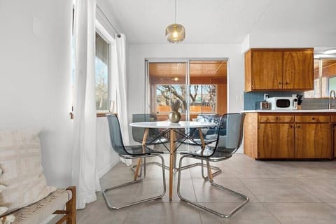 Right off of the living room you'll find the dining nook with a darling dining table for four