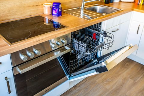 Fridge, stovetop, dishwasher, coffee/tea maker