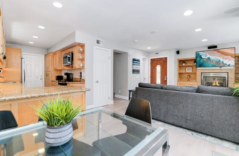 A full bathroom is just to the left of the front door, ensuring guests' comfort.