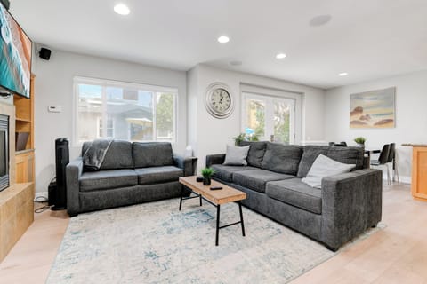 "Living room offers comfortable lounging for families and friends. 'This place was amazing!' The pictures accurately represent the furniture and layout of the home. Everything is well maintained and seems like new." - Jamie, guest