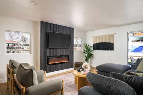 Kick back and relax in an oversized, comfy couch with a 65" smart TV