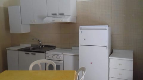 Fridge, stovetop, toaster, cookware/dishes/utensils