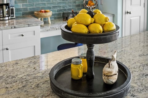 Large kitchen island with plenty of space for cooking, eating, visiting, or planning your next raid together.