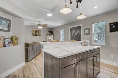 Cook and connect in this open-concept kitchen with a spacious island perfect for meal prep and gatherings.