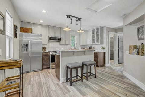 Prepare your favorite meals in this stylish kitchen with stainless steel appliances and ample counter space
