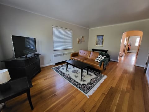 Apt #4: Living room with fold down sofa and HD TV.