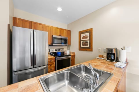 Full kitchen with stainless steel appliances