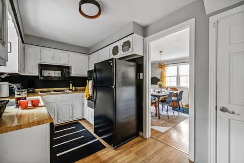 Kitchen and dining separated by a cased opening