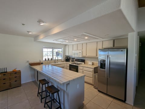 Galley style kitchen with plenty of counter space and all the basic necessities.