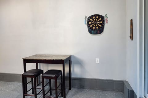 Challenge your family to a game of darts. Hit the dart board please!