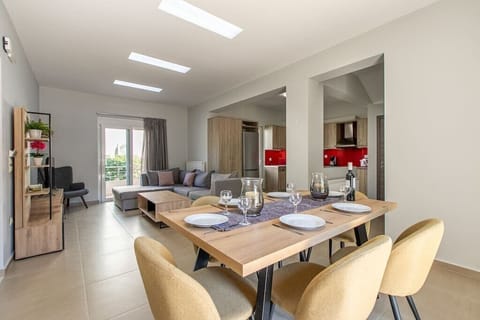 Experience a luminous and welcoming retreat in our living area, where you'll find a comfortable sofa, dining table, well-equipped kitchen, and a balcony for added brightness.