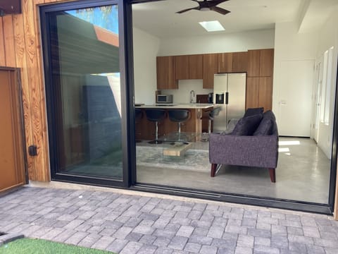 Enjoy Indoor outdoor living with 12 ft slider to private garden oasis.