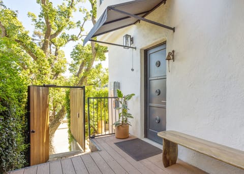 Front door with gated entrance leading to street