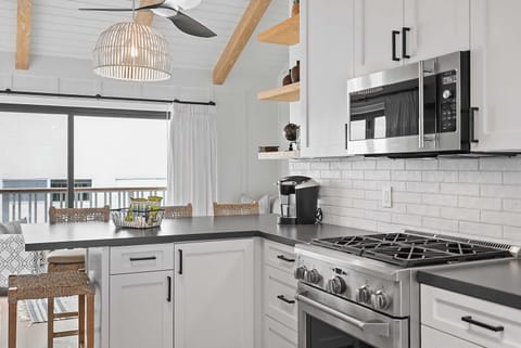 The kitchen is equipped with premium appliances and modern fixtures.