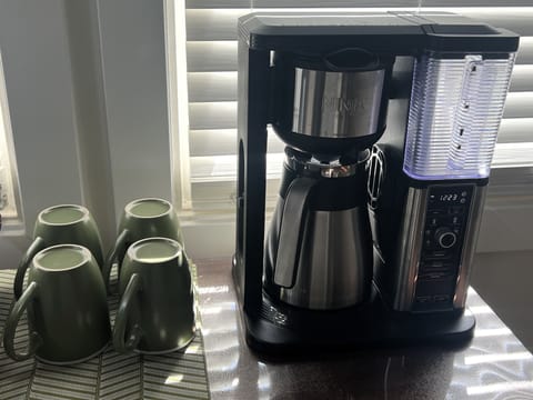 Ninja coffee maker with reusable coffee filter.  Can make various cup sizes