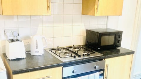 Fridge, microwave, electric kettle, cookware/dishes/utensils