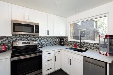 stainless steel appliances for the win! Enjoy using this new electric stove, microwave and dishwasher.