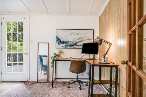 Close-up of the office area and back door leading out to the back sun deck and backyard