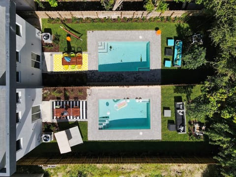 Aereal view of the two private backyards and pools. 