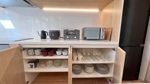 Fridge, microwave, stovetop, cookware/dishes/utensils