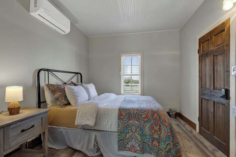 Queen bed provided in the guest house.