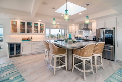This bar area in the kitchen is a great place to gather while the chef works.