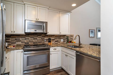 Full Equipped Kitchen with Stainless Steel Appliances: Refrigerator, Electric Oven & Cooktop, Dishwasher & Microwave