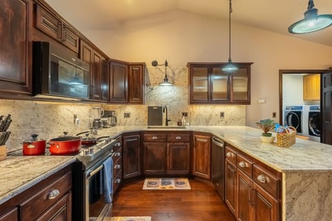 Another view of the kitchen with cookware

