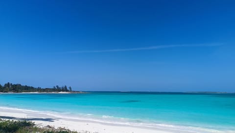 On the beach, sun loungers, beach towels