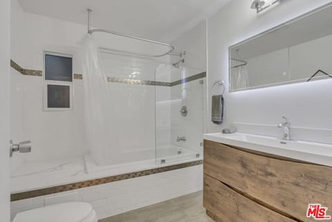 Combined shower/tub, hair dryer, towels, soap