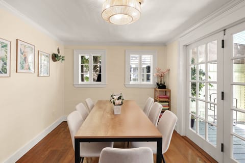 Dining area. Looks out into the patio and backyard. We've added curtains.