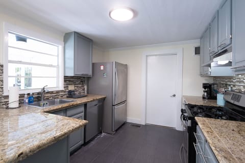Kitchen and door to laundry/supply room.