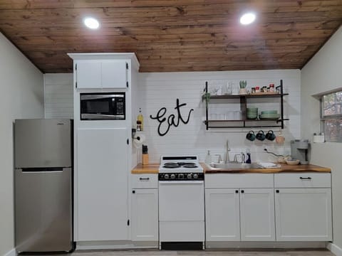 Fully stocked kitchen with cookware, pots and pans, basic cooking spices, and Keurig coffee maker!