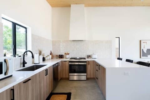 The stocked kitchen has a gas range, dishwasher, microwave, and refrigerator