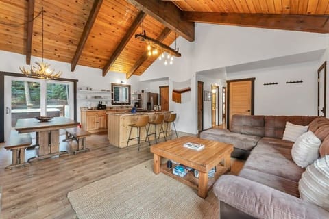 The open floor plan seamlessly blends seating, dining, and relaxation areas, perfect for hosting groups of any size.