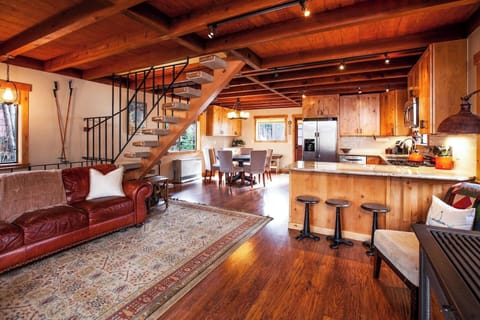 2nd floor is open concept and equipped with a bathroom, ample seating and a wood burning stove.
