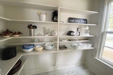 Huge walk in pantry stocked with all the essentials to cook a homemade meal.
