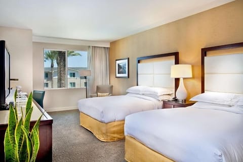 Unit with 2 Queen beds. Exact unit will be assigned upon arrival. Views, colors, and decor may vary.